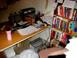 The desk, shredder,
and the bookshelf