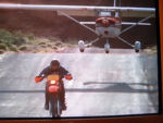 Motorcycle racing a Cessna
& the bike's winning