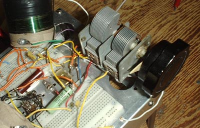  Photo, variable capacitor mounted on breadboard.  One section is larger than the other.