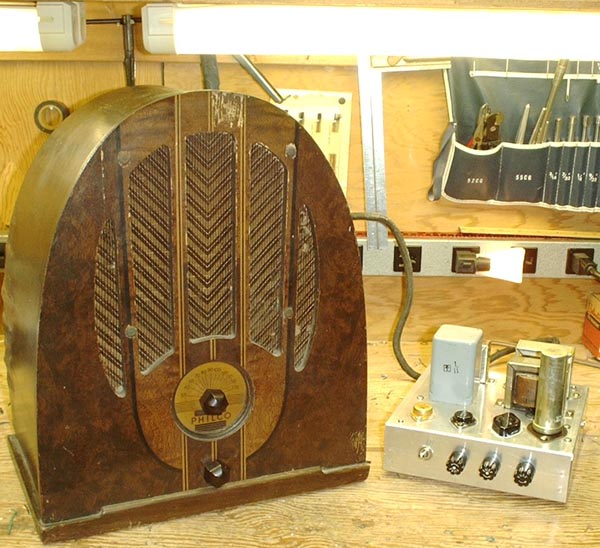 Photo of antique radio with power supply at right.