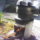 Rice being steamed in a traditional Japanese mushiki steamer to make mochi rice cakes