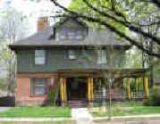 Picture of house at 44 Kenyon: brick, olive green shingle w/ ocher trim