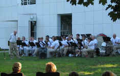 Picture of the whole barss and wind ensemble in front of the seminary