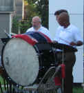 Picture of the percussionist with a huge bass drum