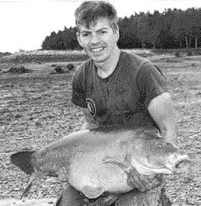 A Frenchman with a  22 kilo carp. Bill Clinton enjoys carps. He named this one "Monica". Click for more carp!