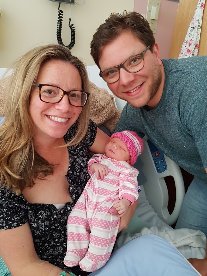 Suzanne and Bradley holding Sophie - 2021