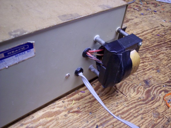  Photo of transformer mounted on back of case.