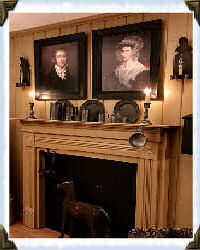 two portraits above fireplace