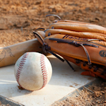 bat, ball and glove at home plate