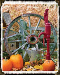 wagon wheel, water pump and pumpkins