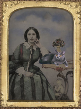 old photo of woman and cat