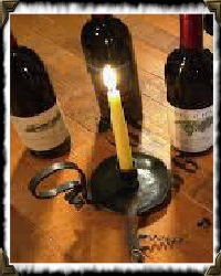 candle and wine bottles