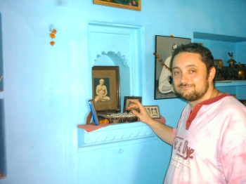 I am touching Lahiri Mahasaya's shoes whilst visiting the house of Shibendu lahiri - Grandson of the great Master - in Varanasi - India / March 2004